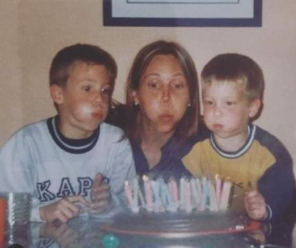 Dani Olmo with his brother and mother celebrating a birthday.